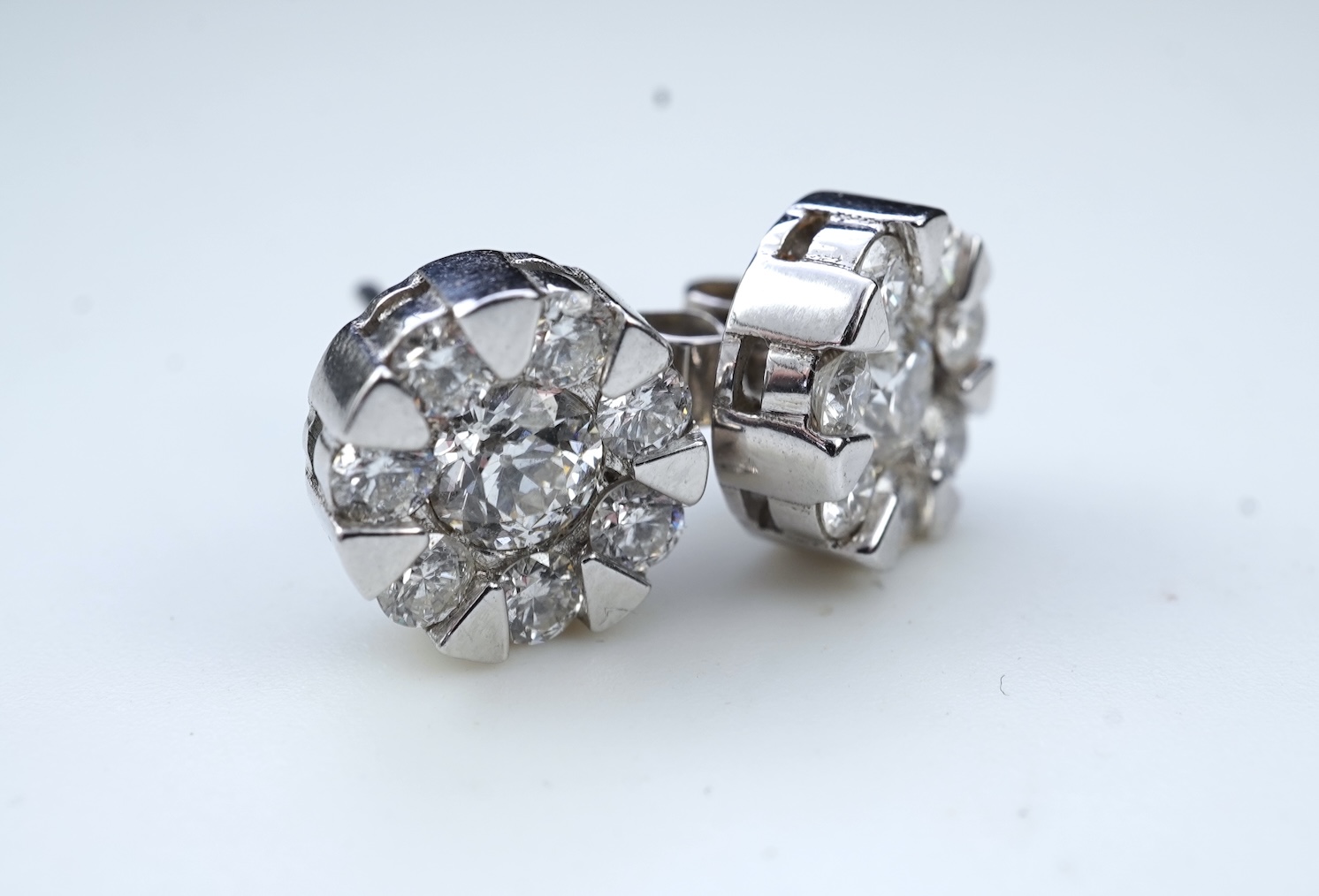 A pair of diamond stud earrings